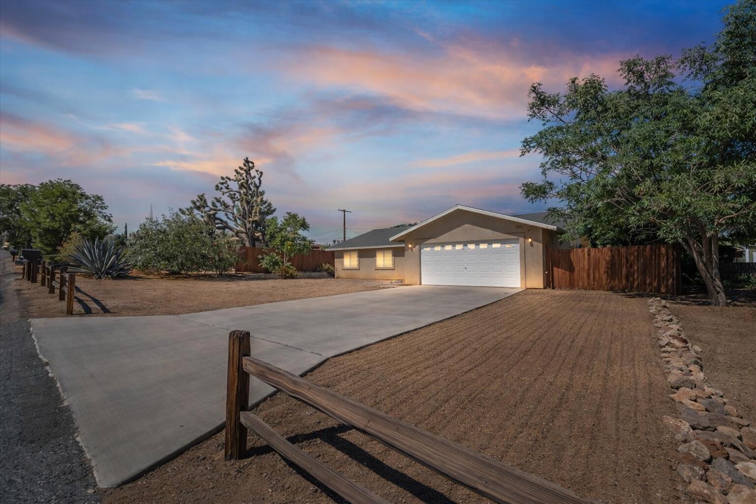 7562 Inca Trail Yucca Valley, CA 92284 - Photo 2 of 30 a view of a house with a yard
