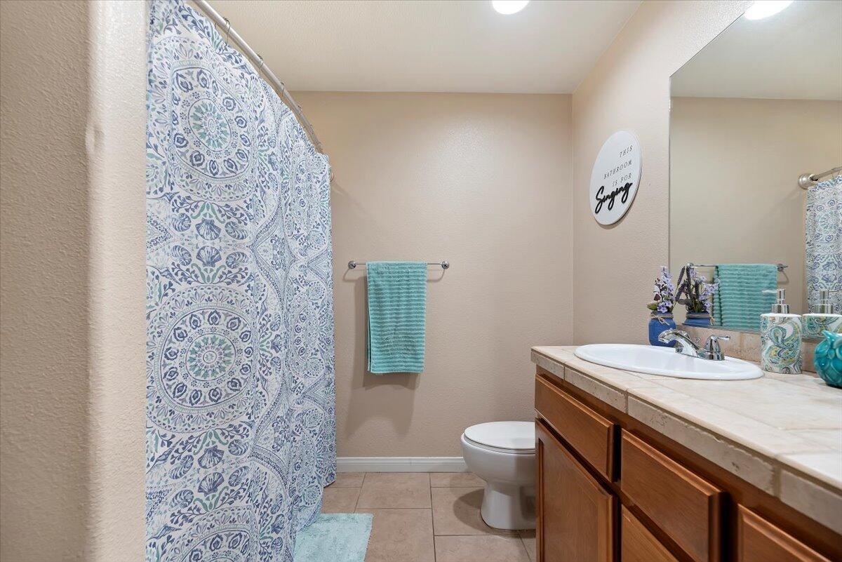 7562 Inca Trail Yucca Valley, CA 92284 - Photo 21 of 30 a bathroom with a sink toilet vanity and shower