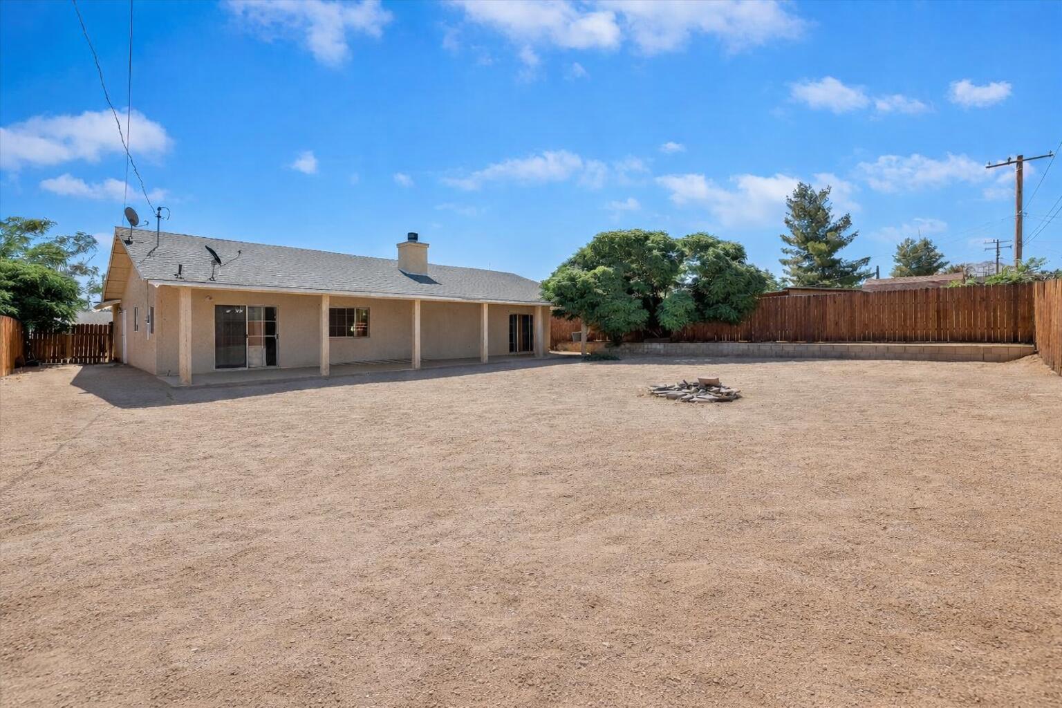 7562 Inca Trail Yucca Valley, CA 92284 - Photo 26 of 30 a view of a house with a yard