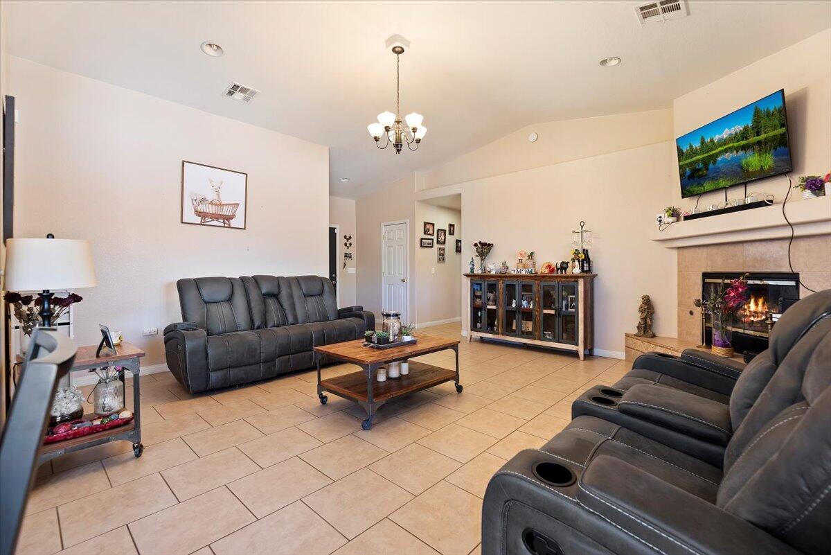 7562 Inca Trail Yucca Valley, CA 92284 - Photo 6 of 30 a living room with furniture and a flat screen tv