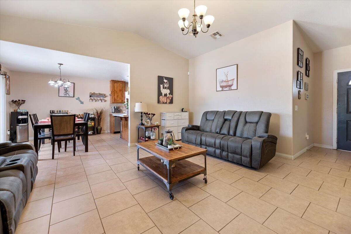 7562 Inca Trail Yucca Valley, CA 92284 - Photo 7 of 30 a living room with furniture and a dining table