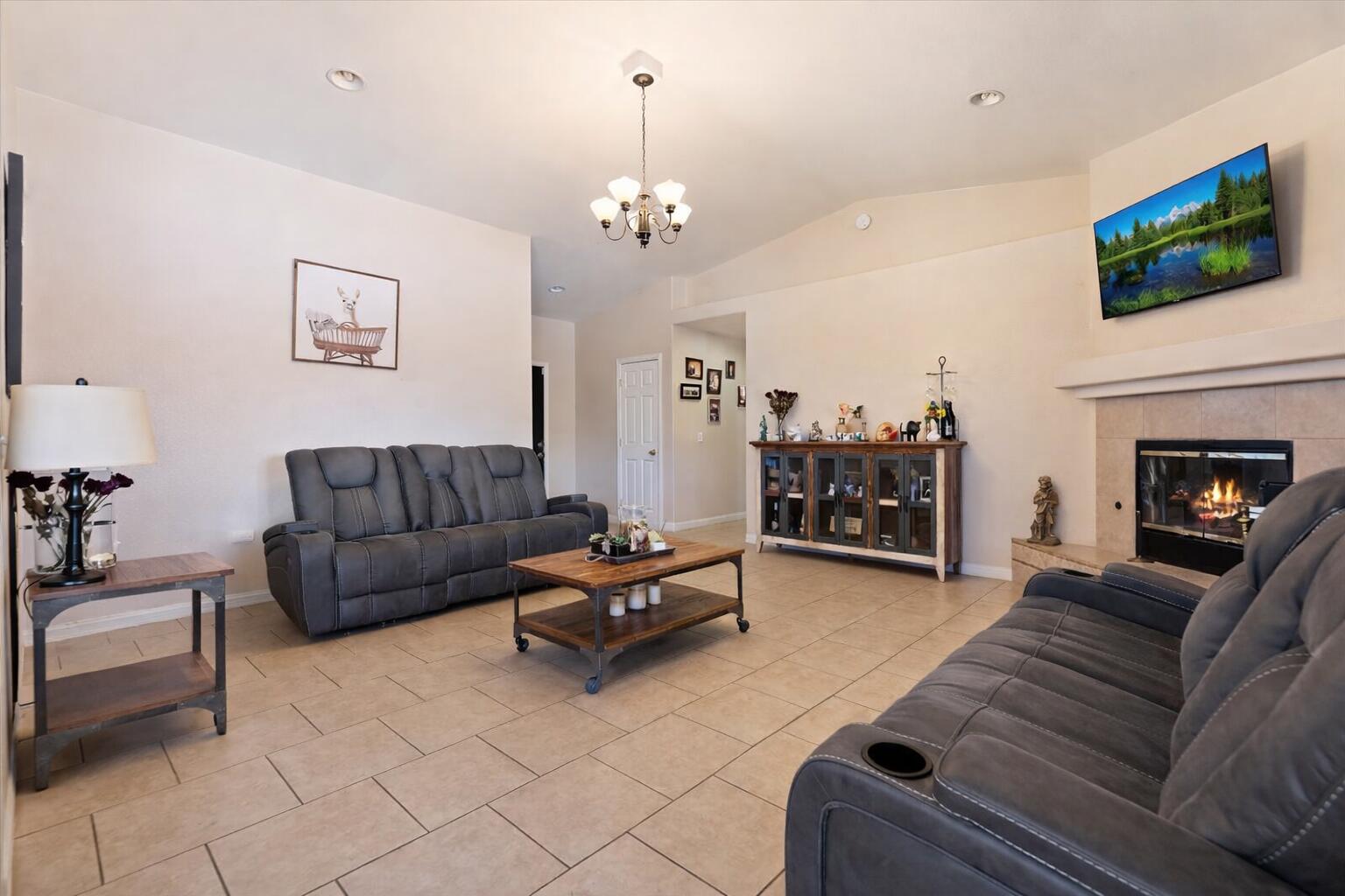 7562 Inca Trail Yucca Valley, CA 92284 - Photo 9 of 30 a living room with furniture and a flat screen tv
