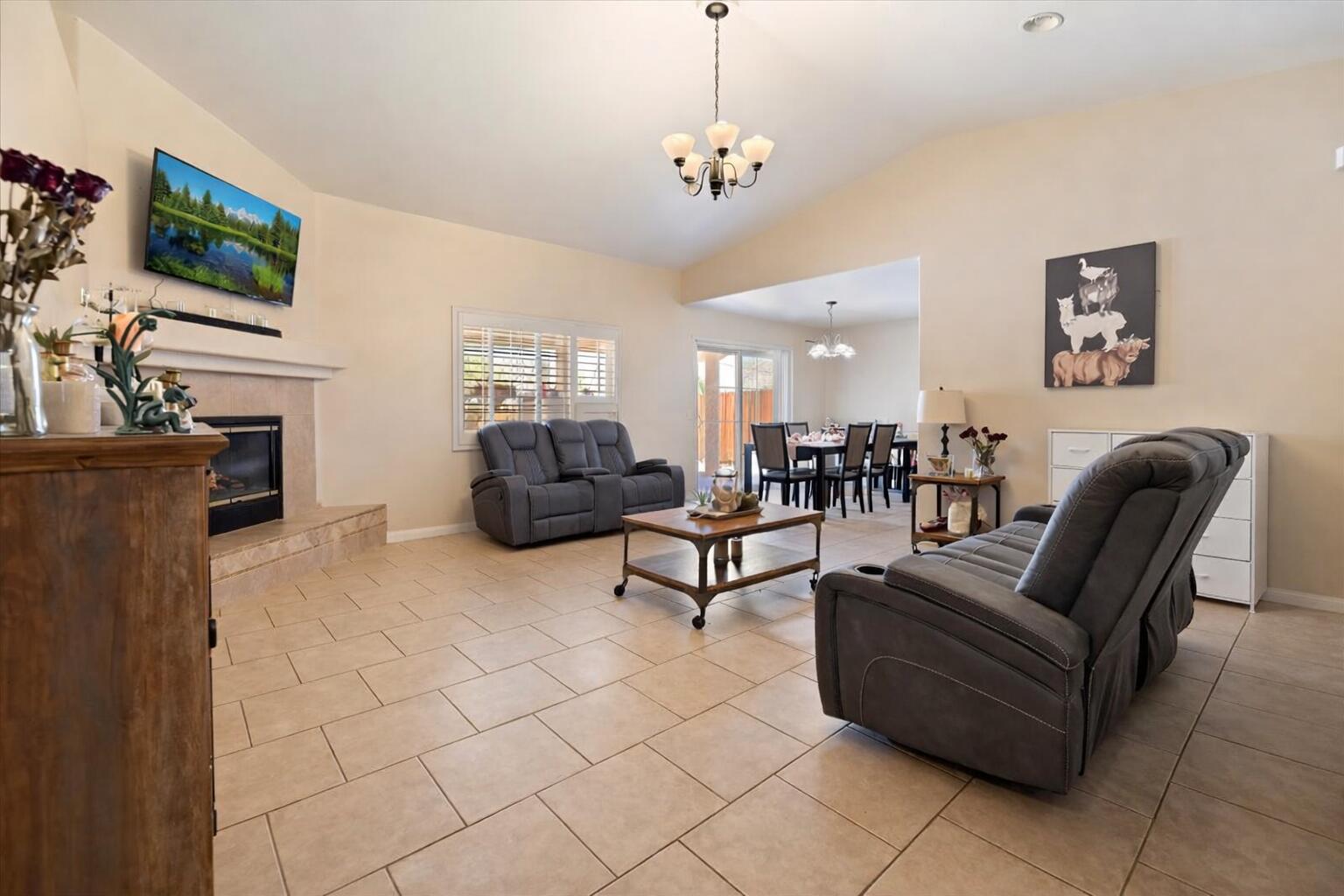 7562 Inca Trail Yucca Valley, CA 92284 - Photo 10 of 30 a living room with furniture a flat screen tv and kitchen view