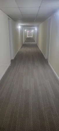 an empty room with wooden floor