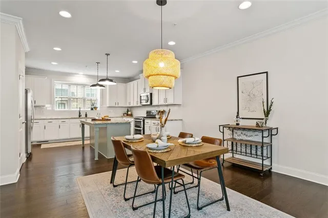 a view of a dining room with furniture and wooden floor
