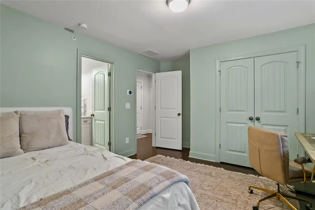 a bathroom with a sink a toilet and shower curtain
