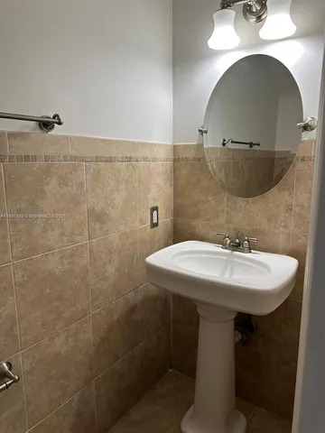 a kitchen with stainless steel appliances granite countertop a refrigerator and a stove