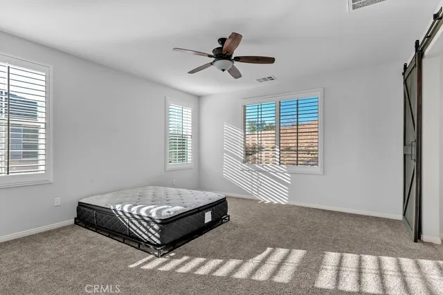 a spacious bathroom with a tub sink shower and mirror