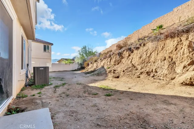 an aerial view of residential house with outdoor space