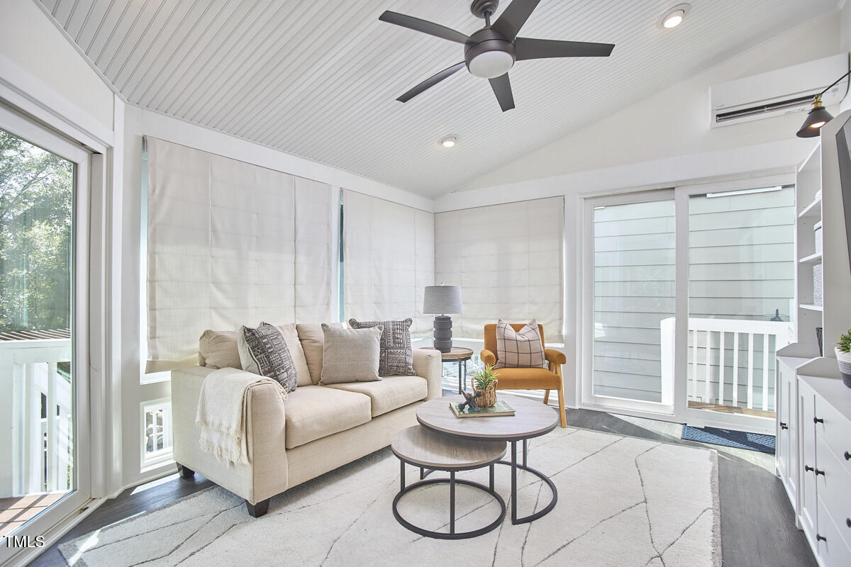 4303 Thetford Road Durham, NC 27707 - Photo 32 of 88 a living room with furniture and a large window