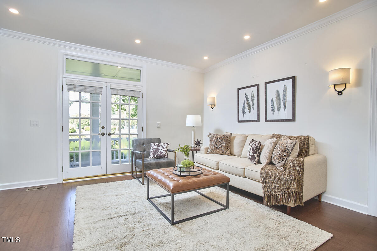 4303 Thetford Road Durham, NC 27707 - Photo 35 of 88 a living room with furniture and a large window
