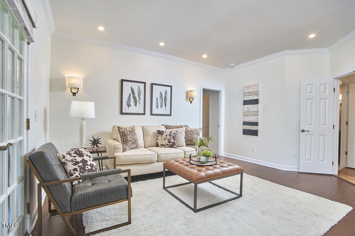 4303 Thetford Road Durham, NC 27707 - Photo 36 of 88 a living room with furniture and a rug