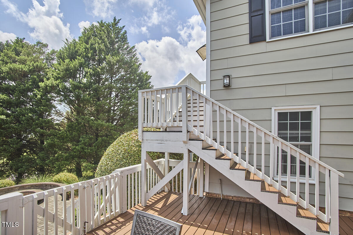 4303 Thetford Road Durham, NC 27707 - Photo 57 of 88 a view of balcony with wooden floor and fence