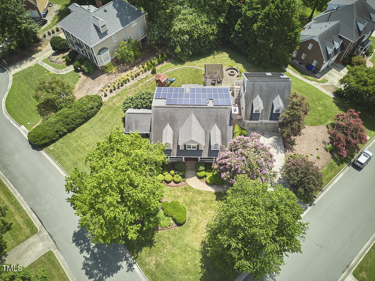 4303 Thetford Road Durham, NC 27707 - Photo 70 of 88 an aerial view of a house with a garden and lake view
