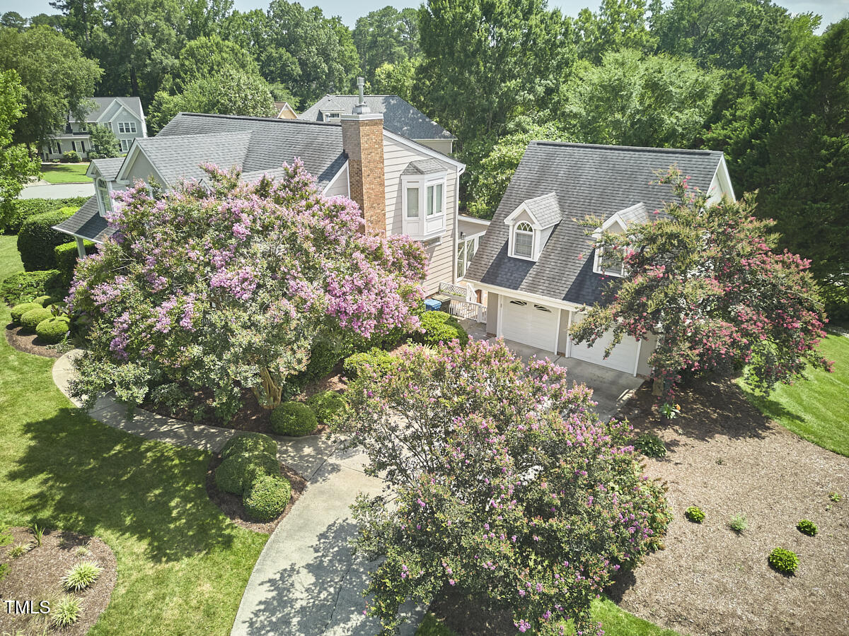 4303 Thetford Road Durham, NC 27707 - Photo 74 of 88 a view of a house with a yard and garden