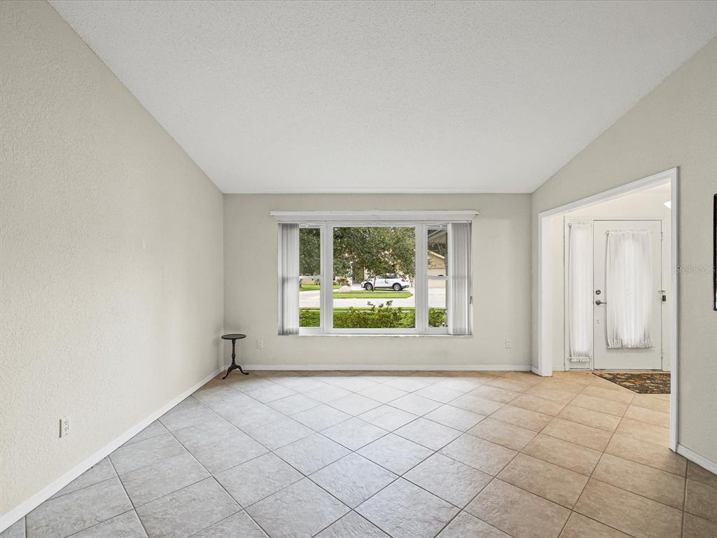 12595 93rd Way North Largo, FL 33773 - Photo 13 of 53 an empty room with windows