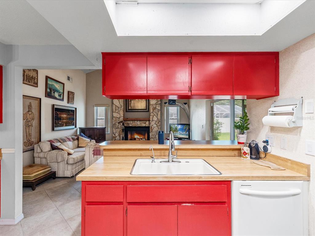 12595 93rd Way North Largo, FL 33773 - Photo 24 of 53 a swimming pool with a large window and red painted walls