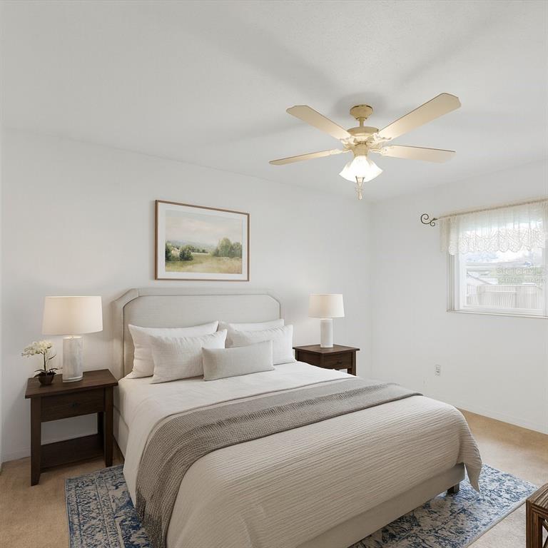 12595 93rd Way North Largo, FL 33773 - Photo 29 of 53 a bedroom with a bed and a chandelier