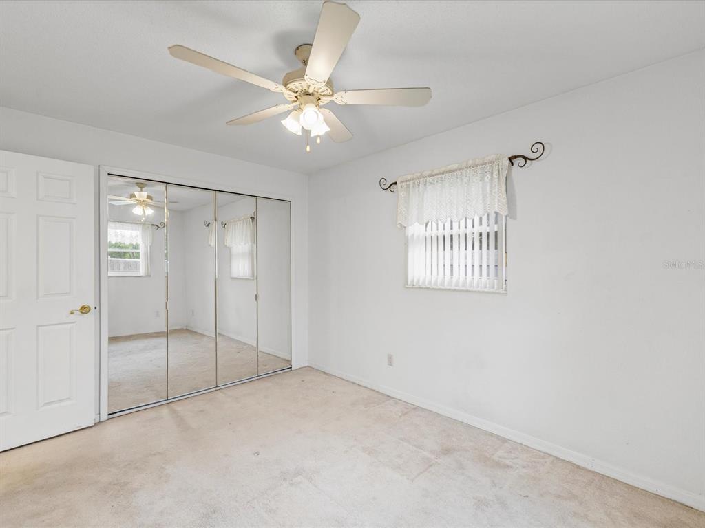 12595 93rd Way North Largo, FL 33773 - Photo 31 of 53 a view of an empty room with a window