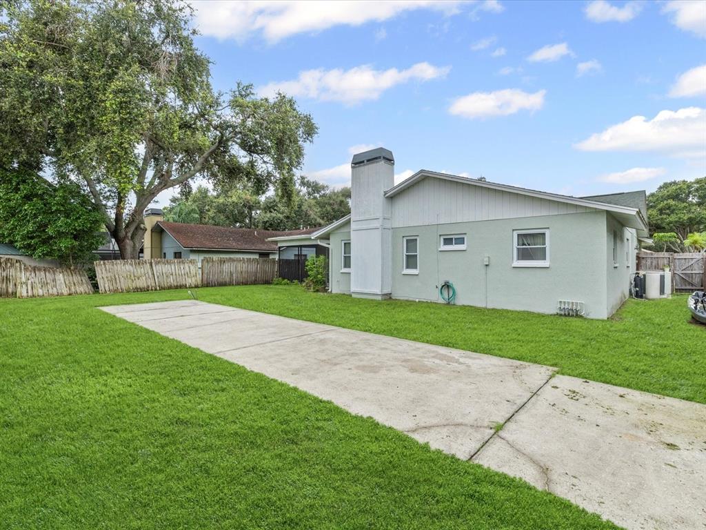 12595 93rd Way North Largo, FL 33773 - Photo 36 of 53 a front view of house with yard and green space