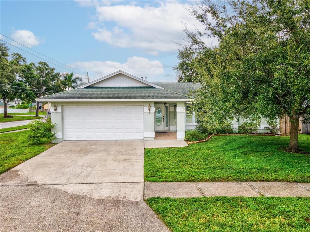 12595 93rd Way North Largo, FL 33773 - Photo 39 of 53 a front view of house with yard and green space