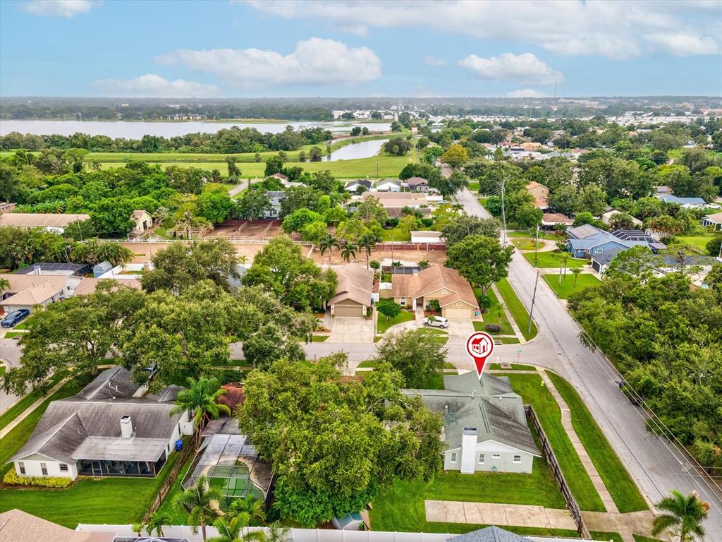 12595 93rd Way North Largo, FL 33773 - Photo 42 of 53 an aerial view of residential houses with outdoor space and trees