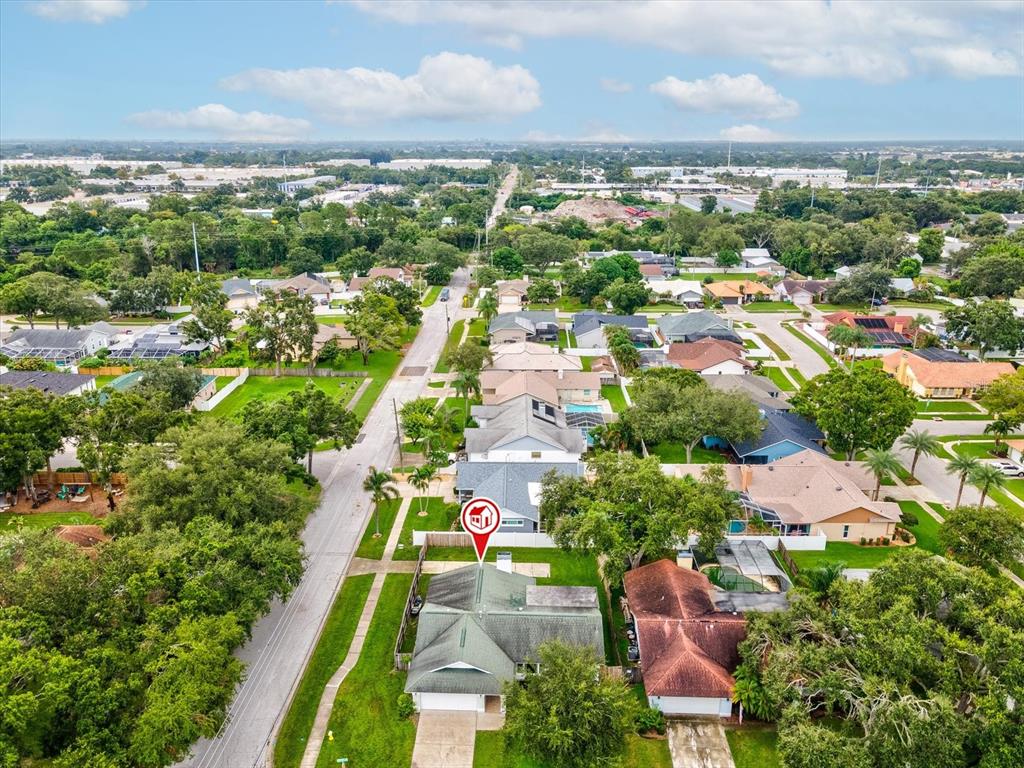12595 93rd Way North Largo, FL 33773 - Photo 43 of 53 an aerial view of residential houses with outdoor space and trees