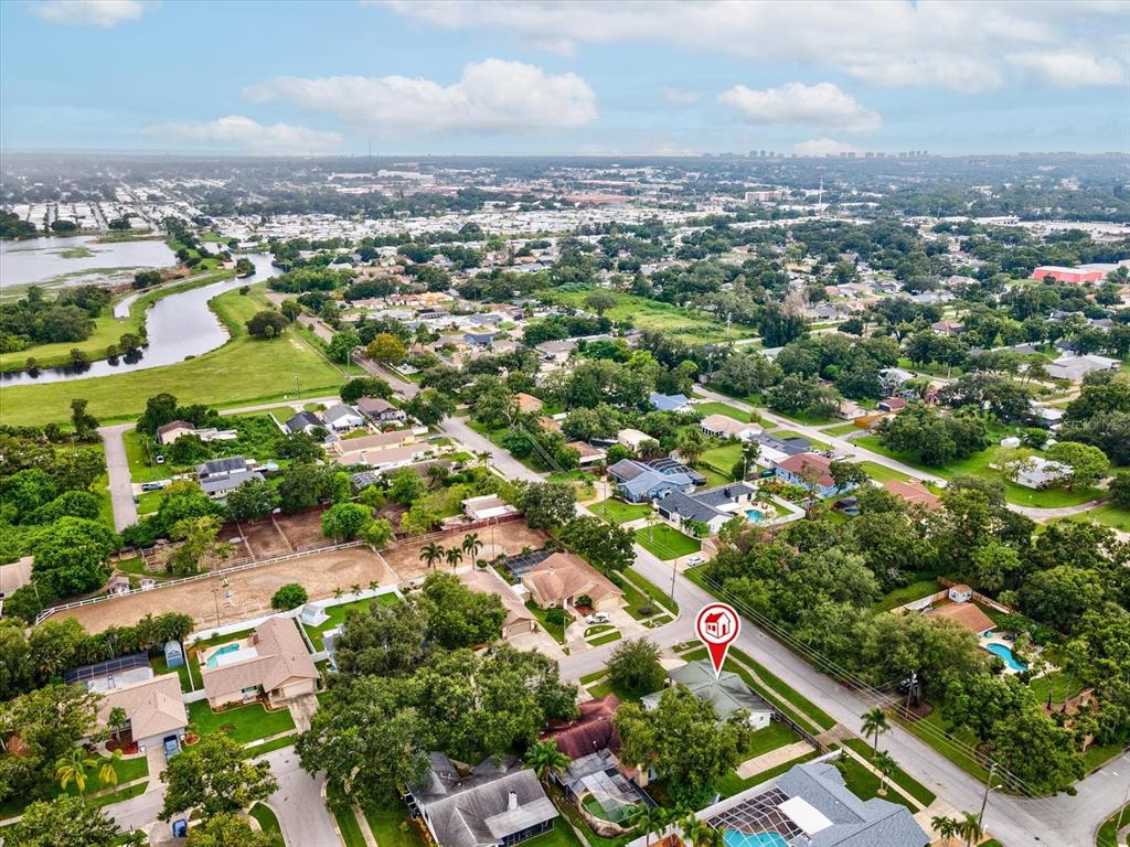 12595 93rd Way North Largo, FL 33773 - Photo 44 of 53 an aerial view of residential houses with outdoor space and trees