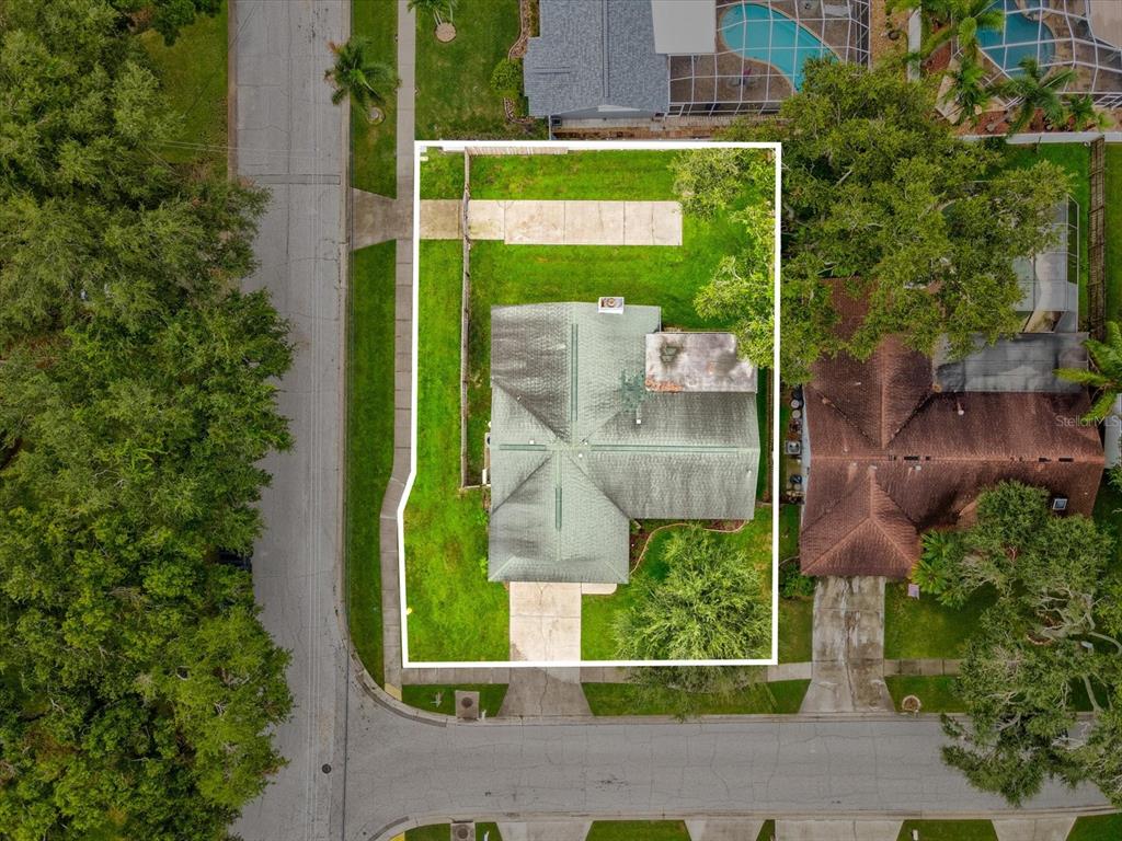 12595 93rd Way North Largo, FL 33773 - Photo 46 of 53 an aerial view of a house with a garden and plants