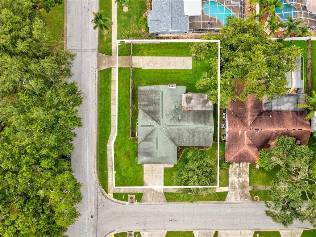 12595 93rd Way North Largo, FL 33773 - Photo 47 of 53 an aerial view of a house with a garden and plants
