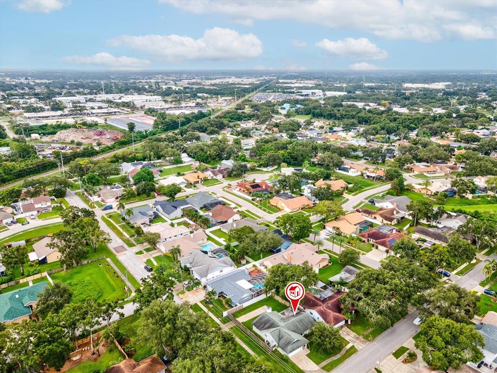 12595 93rd Way North Largo, FL 33773 - Photo 49 of 53 an aerial view of residential houses with outdoor space