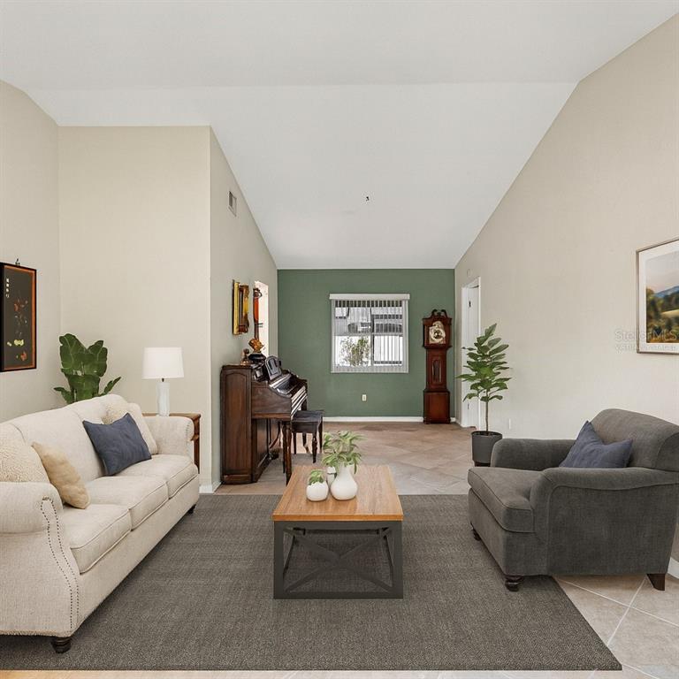 12595 93rd Way North Largo, FL 33773 - Photo 5 of 53 a living room with furniture and a wooden floor