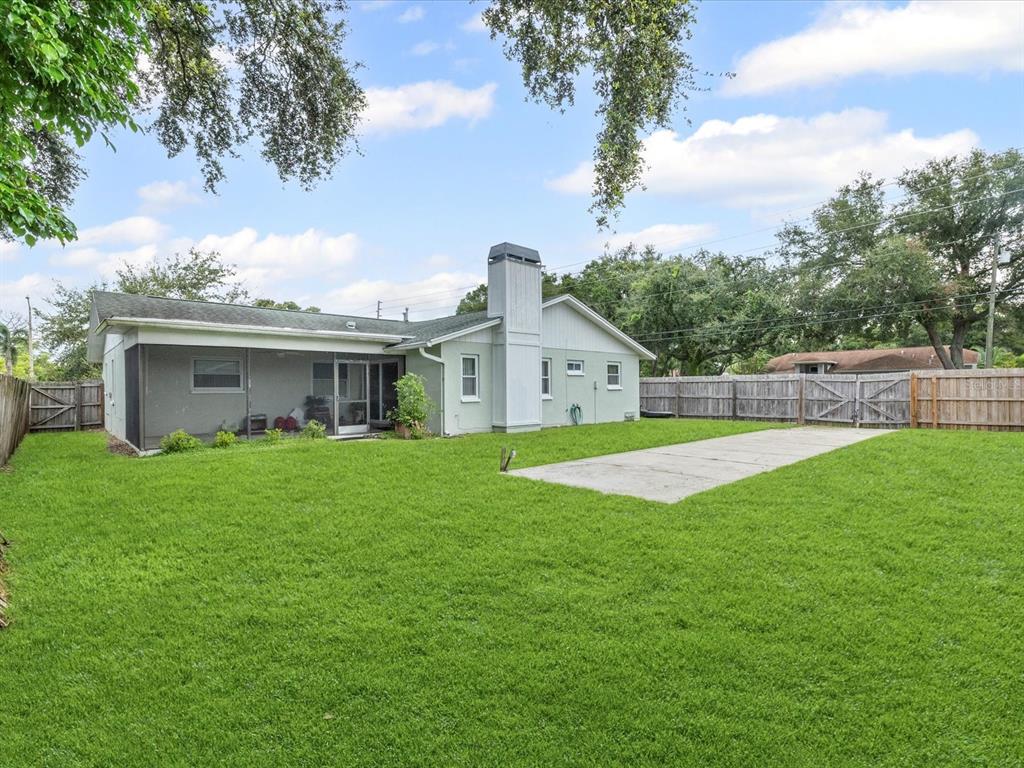 12595 93rd Way North Largo, FL 33773 - Photo 7 of 53 a front view of house with yard and green space