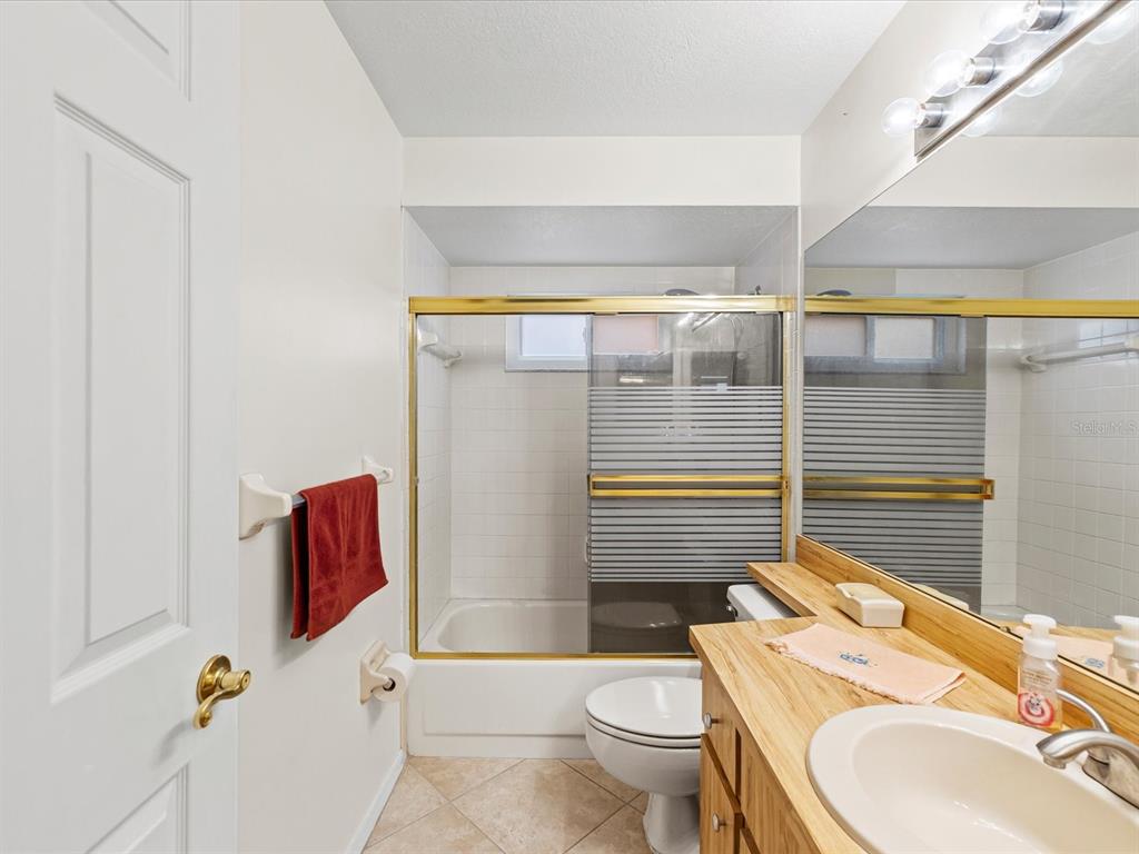 12595 93rd Way North Largo, FL 33773 - Photo 8 of 53 a bathroom with a sink toilet and shower