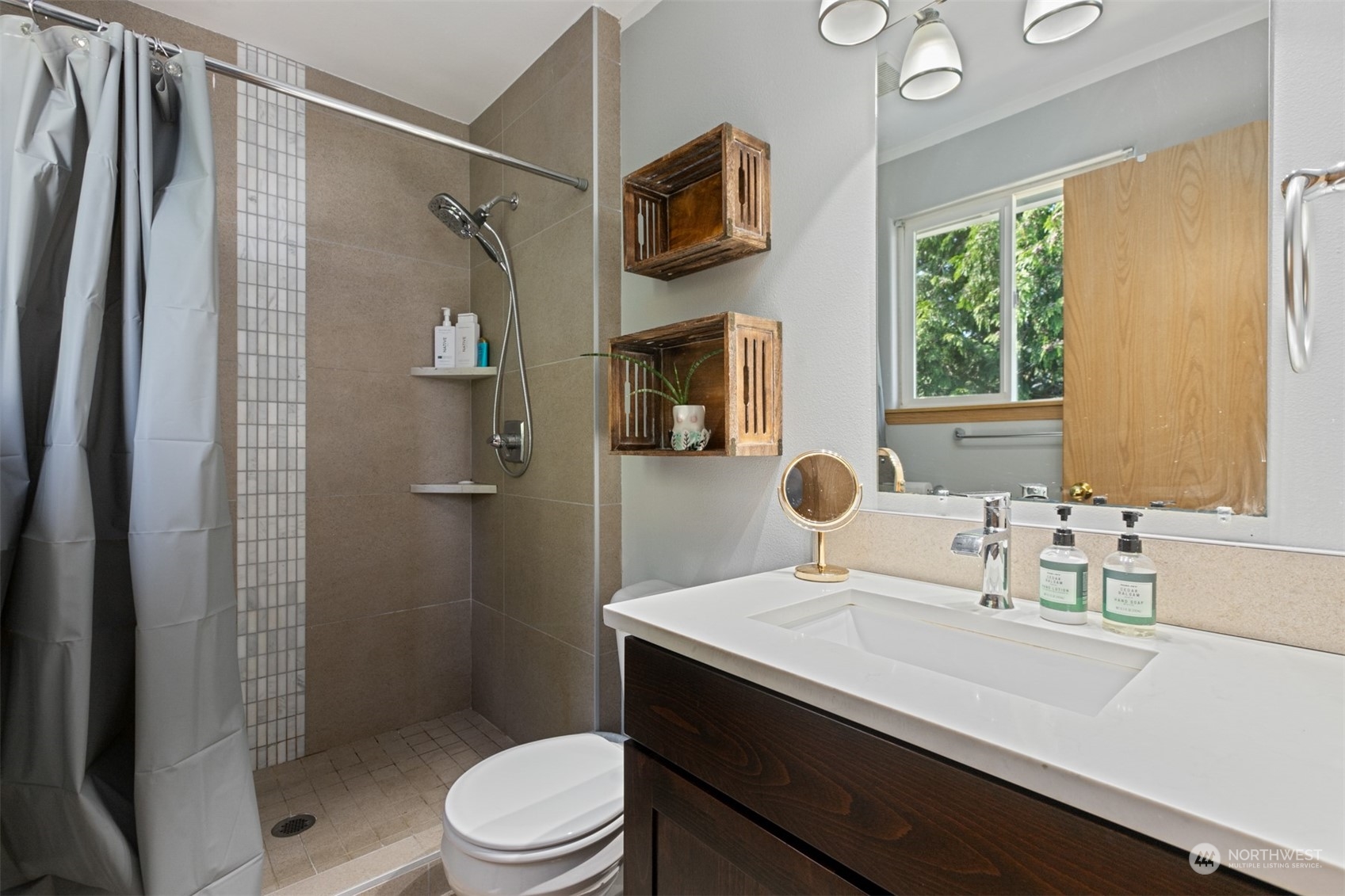 1117 58th Place Southwest Everett, WA 98203 - Photo 14 of 25 a bathroom with a sink a toilet and shower
