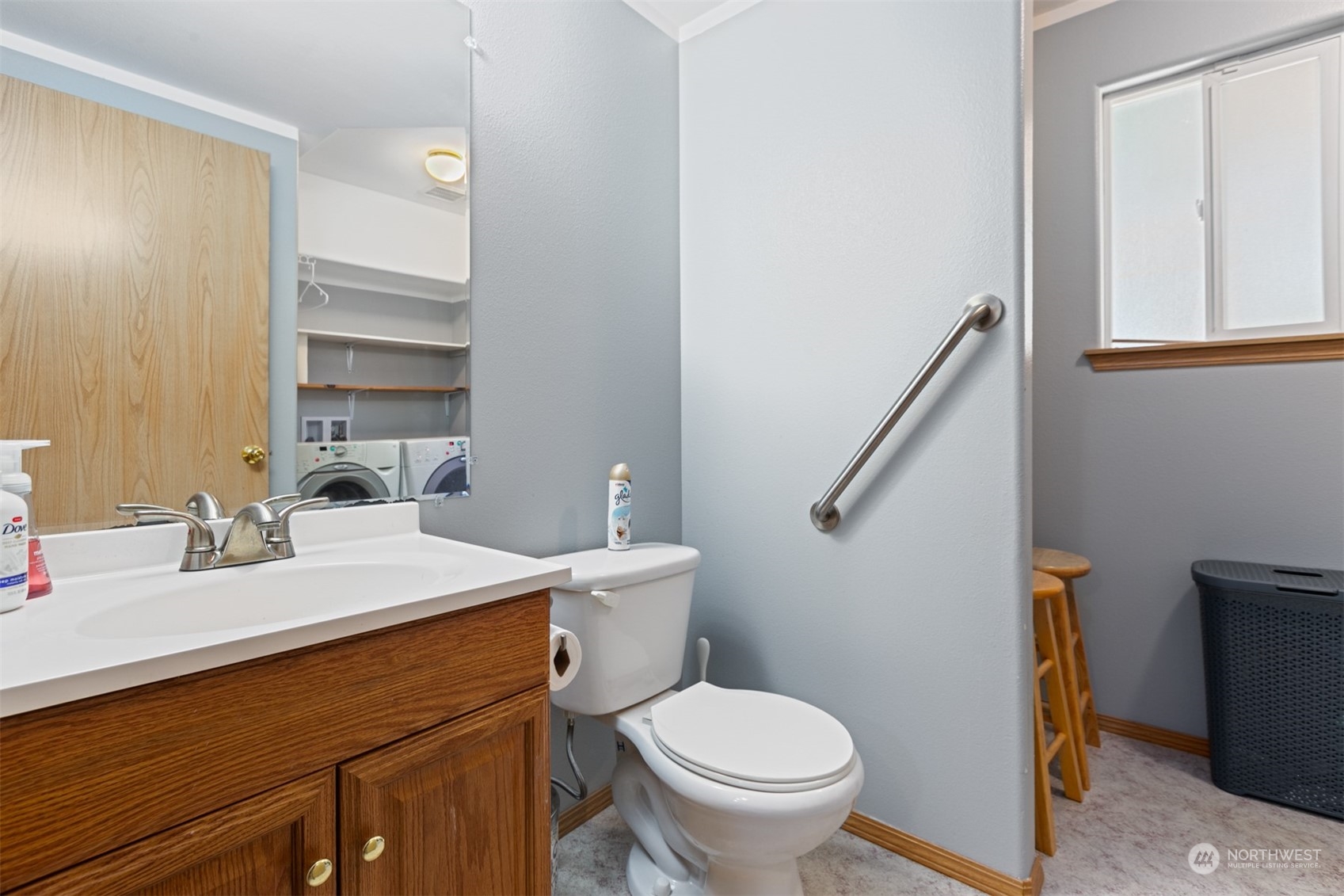 1117 58th Place Southwest Everett, WA 98203 - Photo 19 of 25 a bathroom with a toilet a sink and a mirror