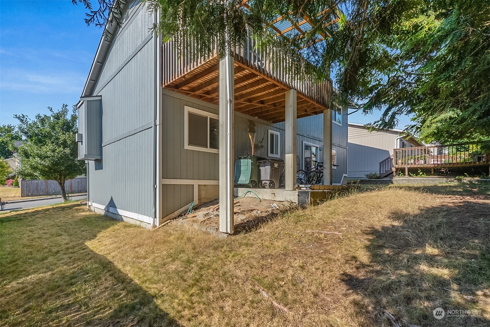 1117 58th Place Southwest Everett, WA 98203 - Photo 21 of 25 a front view of a house with a yard and garage