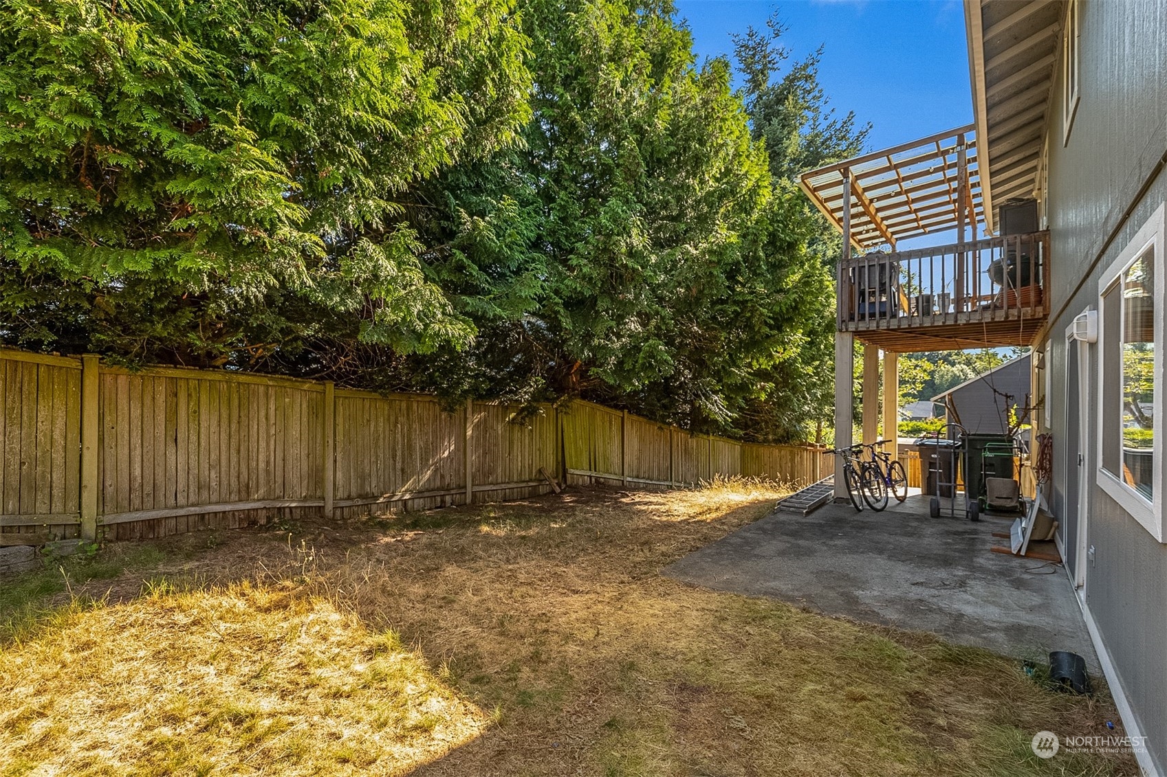1117 58th Place Southwest Everett, WA 98203 - Photo 22 of 25 a view of backyard with tub and trees in the background
