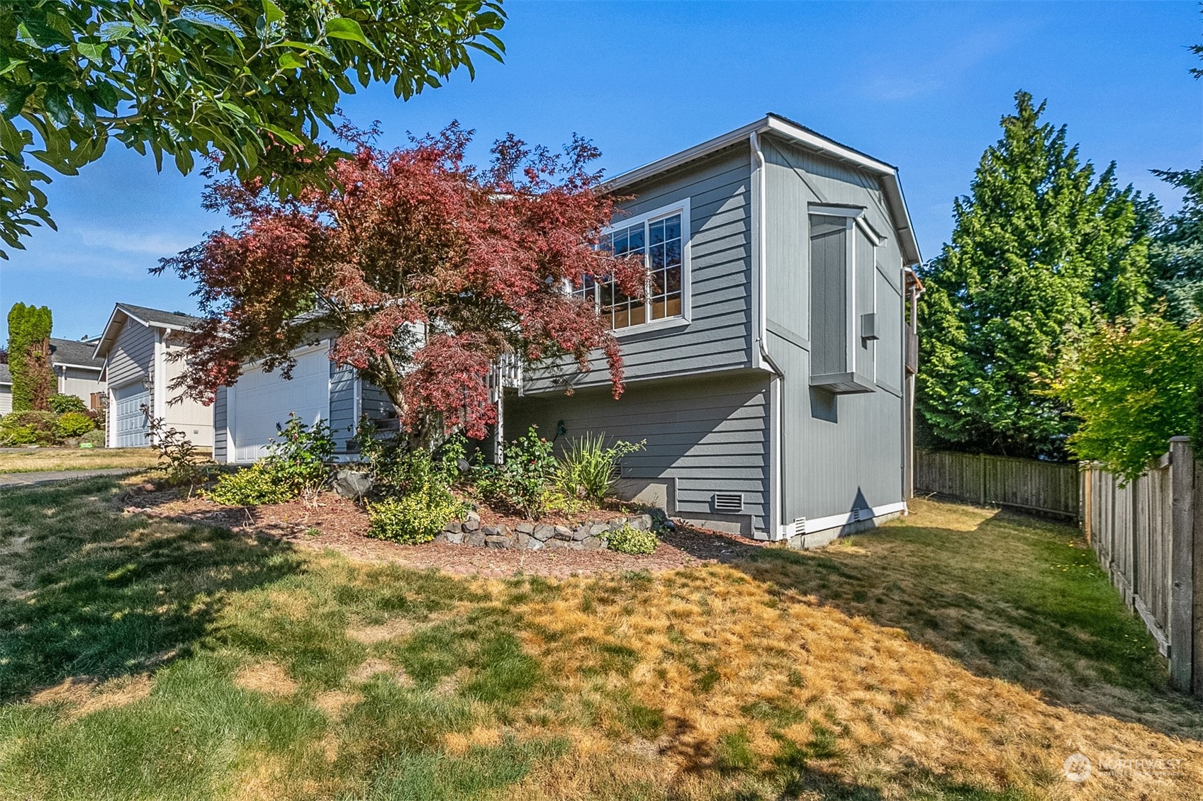 1117 58th Place Southwest Everett, WA 98203 - Photo 23 of 25 a front view of a house with a yard