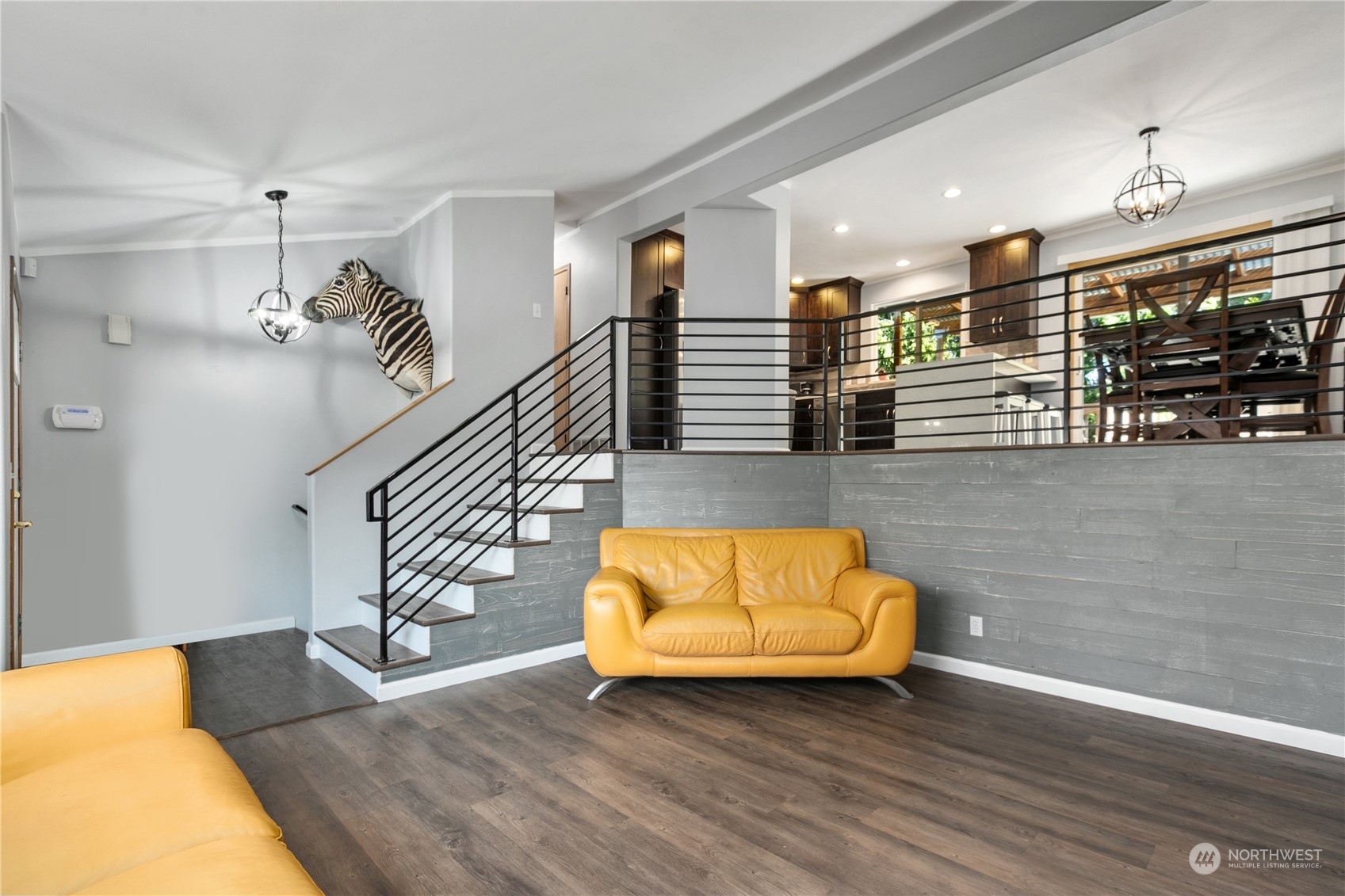 1117 58th Place Southwest Everett, WA 98203 - Photo 5 of 25 a view of a room with wooden floor and a potted plant