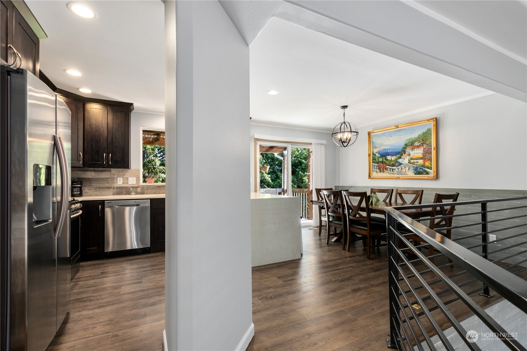 1117 58th Place Southwest Everett, WA 98203 - Photo 6 of 25 a kitchen with stainless steel appliances kitchen island granite countertop a stove and a refrigerator
