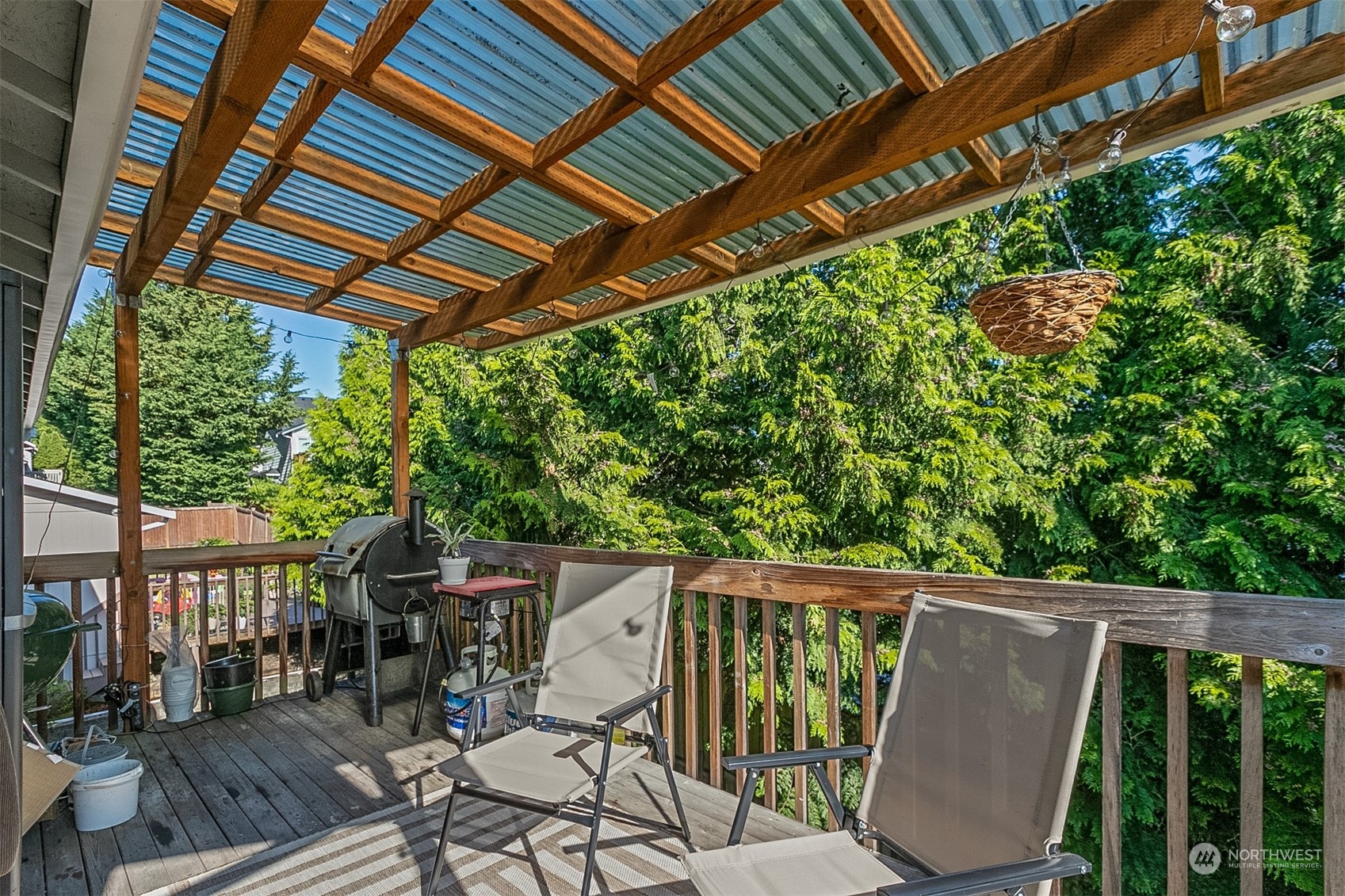 1117 58th Place Southwest Everett, WA 98203 - Photo 10 of 25 a view of a patio with table and chairs and wooden floor