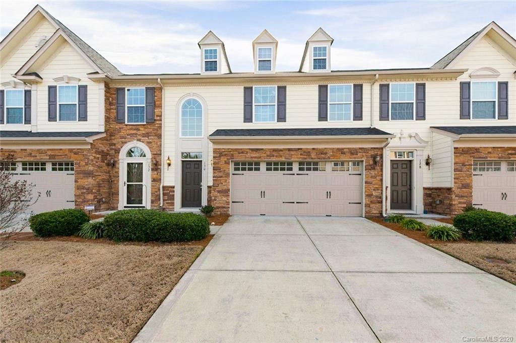 130 Inlet Point Drive Tega Cay, SC 29708 - Photo 1 of 13 a front view of a house