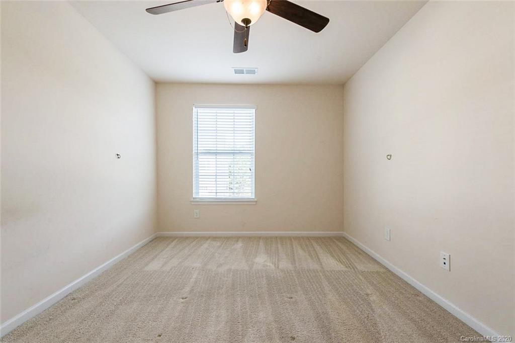 130 Inlet Point Drive Tega Cay, SC 29708 - Photo 11 of 13 an empty room with a window