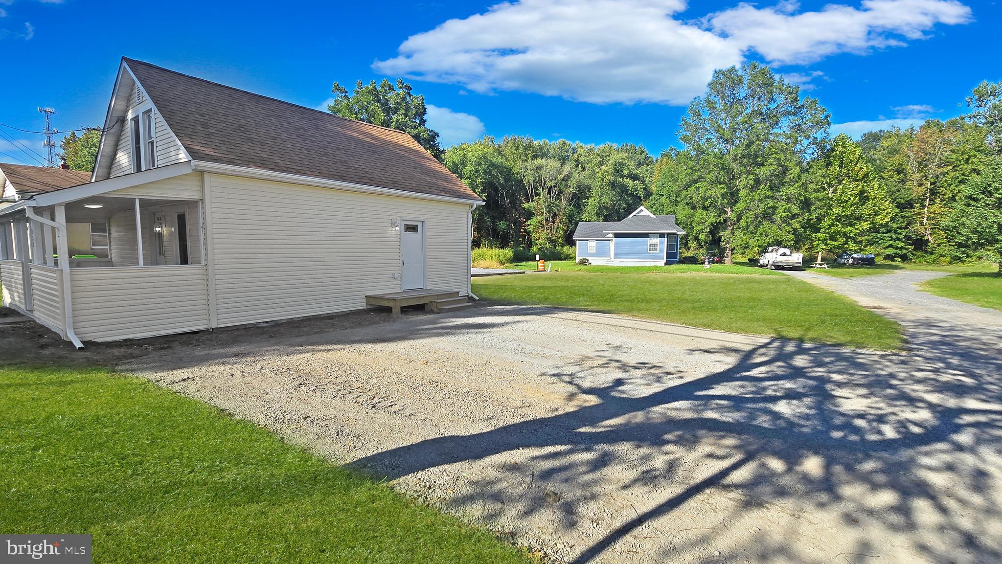 233 Main Street Hartly, DE 19953 - Photo 11 of 26 a view of a house with a yard