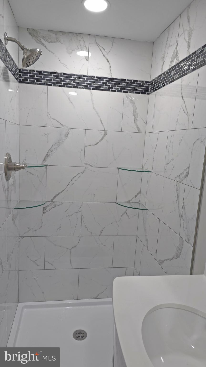 233 Main Street Hartly, DE 19953 - Photo 17 of 26 a bathroom with a shower and a toilet