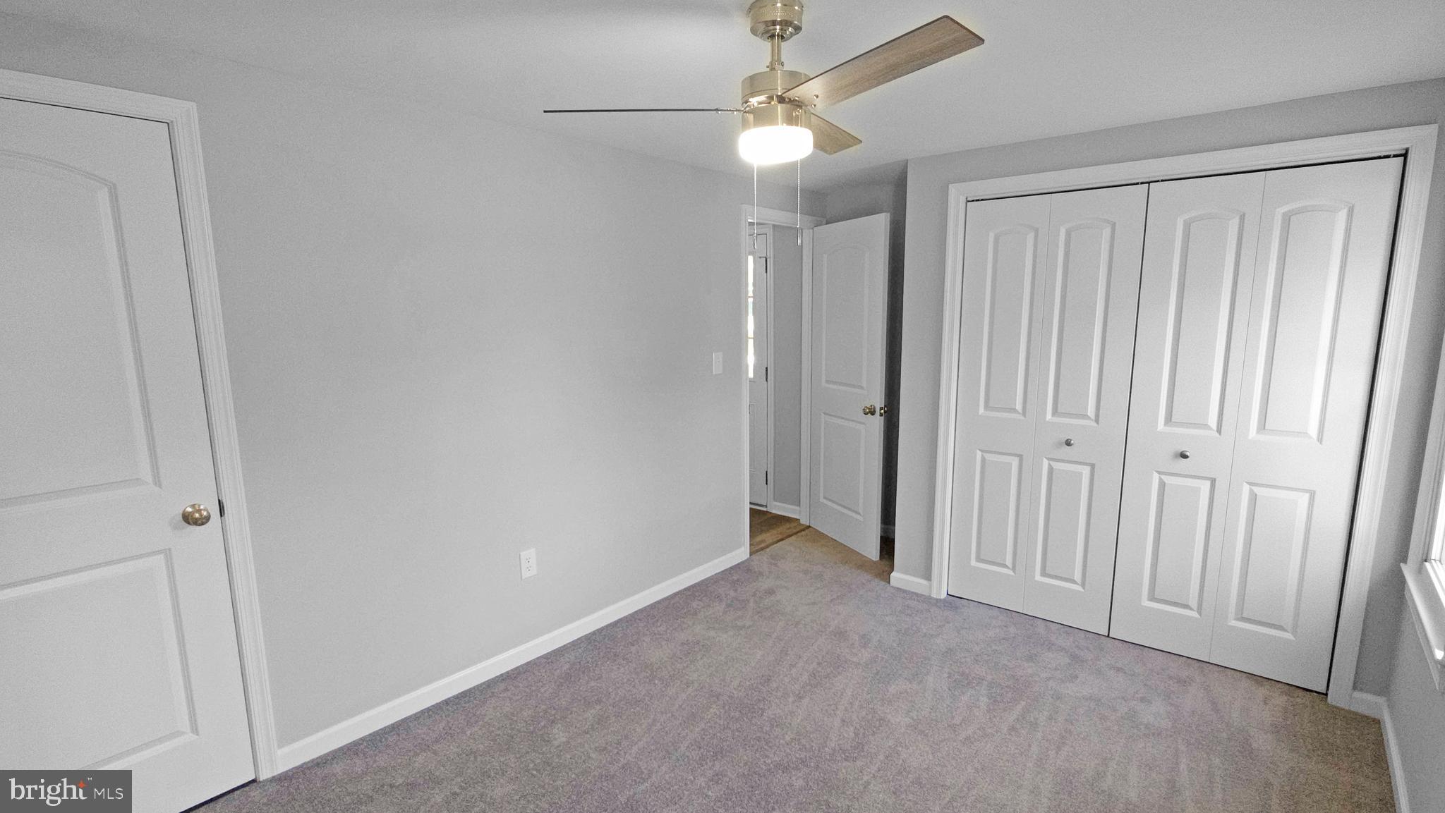 233 Main Street Hartly, DE 19953 - Photo 20 of 26 an empty room with closet and a ceiling fan