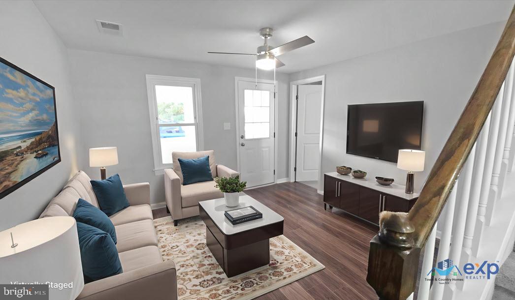233 Main Street Hartly, DE 19953 - Photo 2 of 26 a living room with furniture and a flat screen tv
