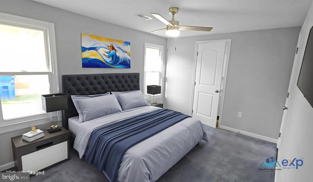 233 Main Street Hartly, DE 19953 - Photo 5 of 26 a bedroom with a bed and a painting on the wall