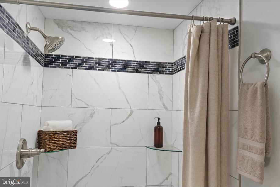 233 Main Street Hartly, DE 19953 - Photo 6 of 26 a bathroom with a shower